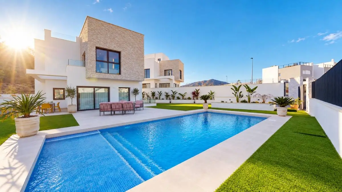 Modern villa with a designer swimming pool and a sunny garden